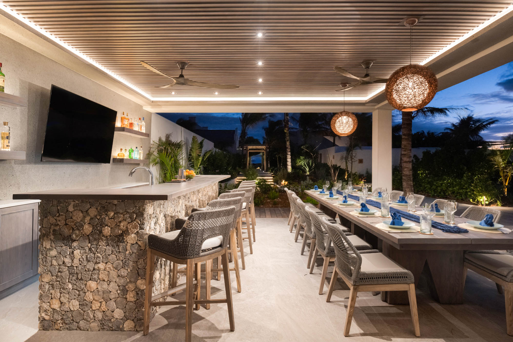 678054013c3cb172e5faa4a6_Ambergris-Cay-Dream-Estate-Away-Luxury-Villa-Bar-and-Dining-Area-Turks-and-Caico