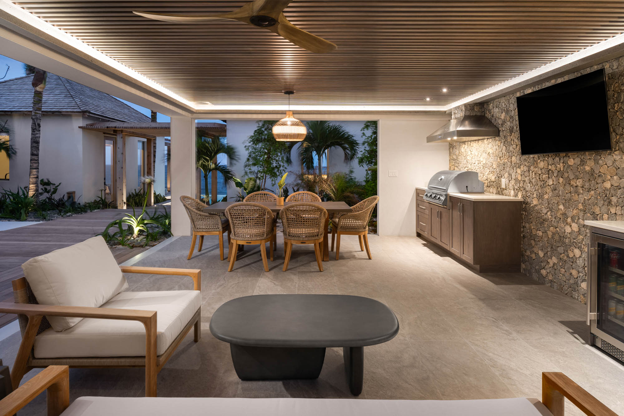 67805401ee26336c8828e048_Ambergris-Cay-Dream-Estate-Away-Villa-BBQ-Open-Air-Seating-Evening-Turks-and-Caicos